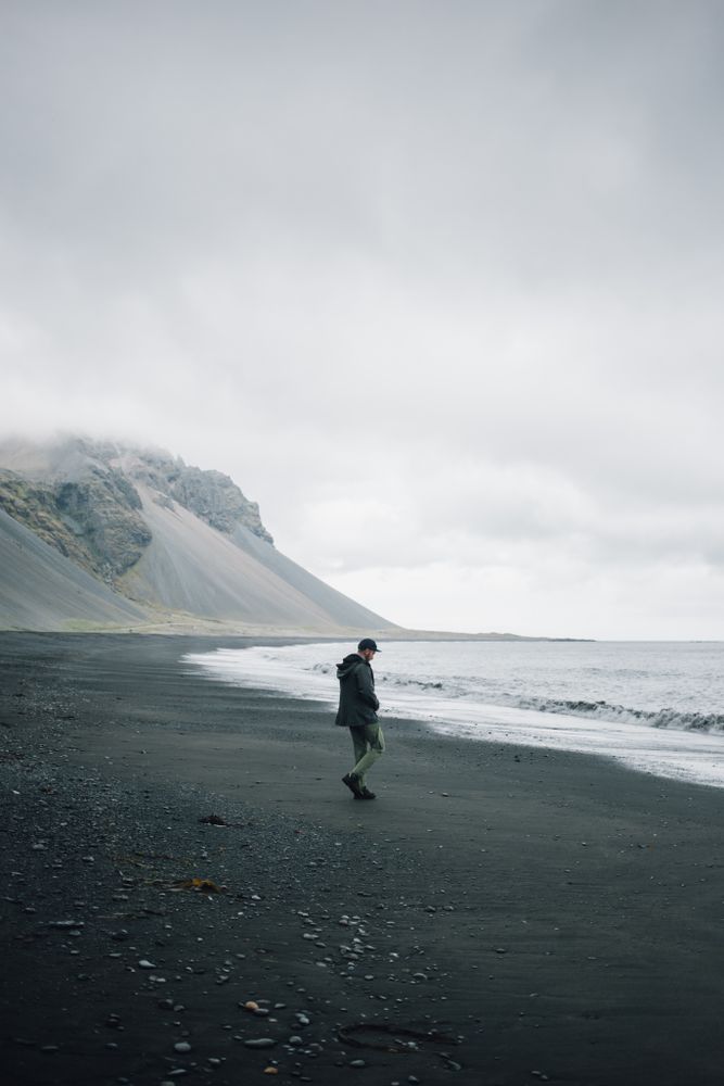 Man walking along coastline on a winter’s day