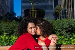Female couple in love hugging in city park 4NWq8b