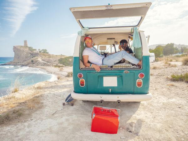 Men relaxing in van