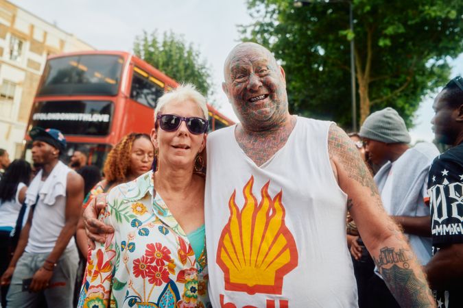 London, England, United Kingdom - August 27, 2022: Tattoed older male and female partner at Carnival