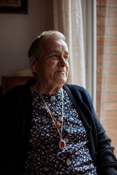 mature woman with personal alarm hanging from the neck