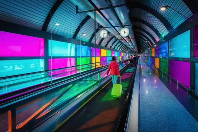 Woman standing on travelator in airport