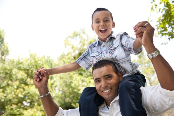 Hispanic Father and Son Having Fun in the Park