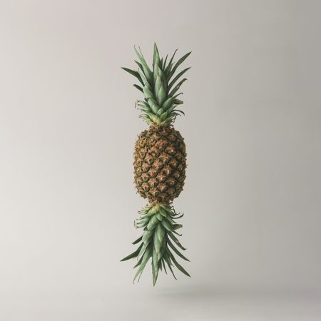 Candy made of ripe pineapple on light background