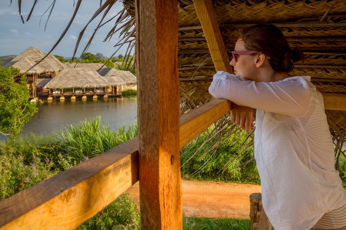 Woman looking at calm lake