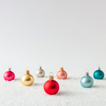 Christmas bauble decorations on snow