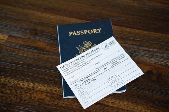 J&J vaccination card on top of passport