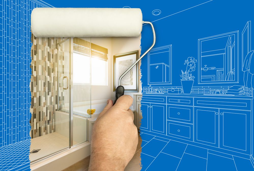 Before and After of Man Painting Roller to Reveal Newly Remodeled Master Bathroom Under Blueprint Drawing Plans.