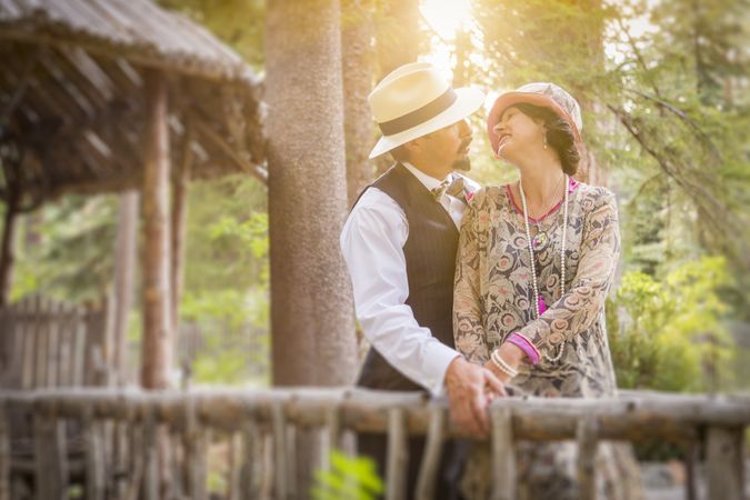 1920s Dressed Cute Couple on Wooden Bridge