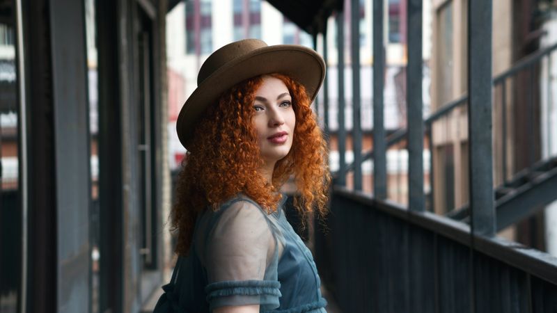 Street portrait of female in hat