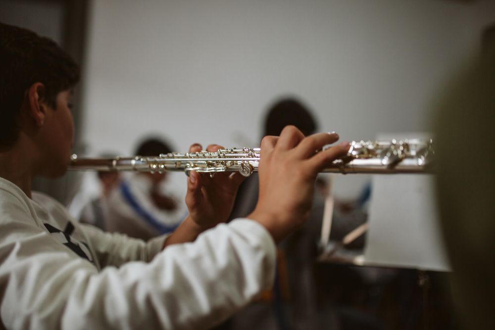 Flute player reading sheet music