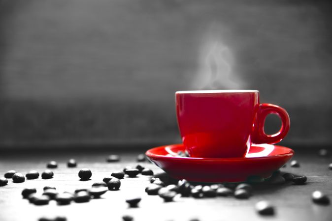 Side view of small red espresso cup