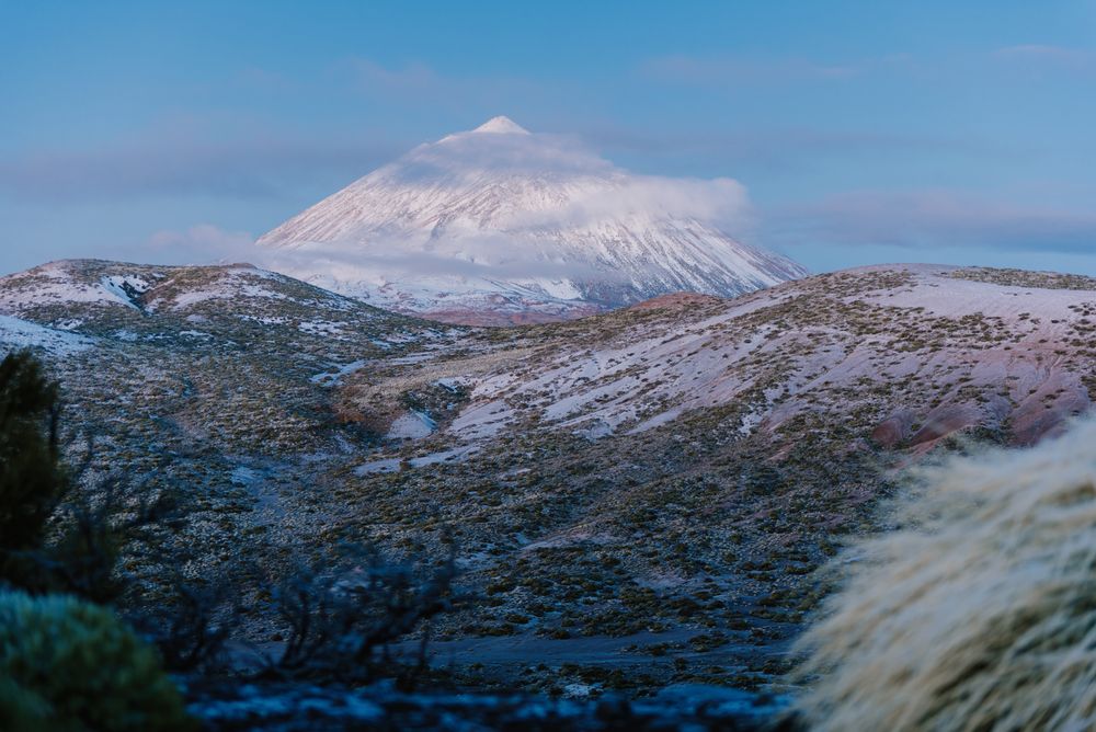 Clouds near snowy mountain