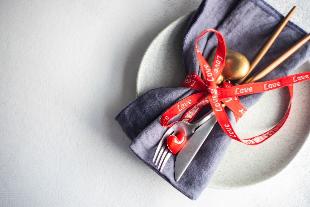 St. Valentine day concept of heart decorations with silverware