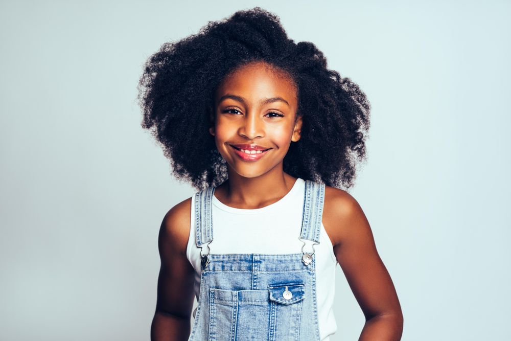 Portrait of happy girl with curly hair