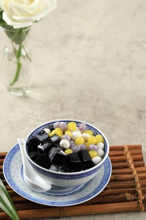 Asian dessert with taro balls and grass jelly, vertical