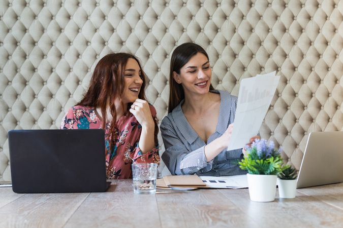 Focused women working on laptops in coworking space