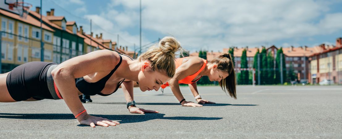 Sportswomen doing push-ups