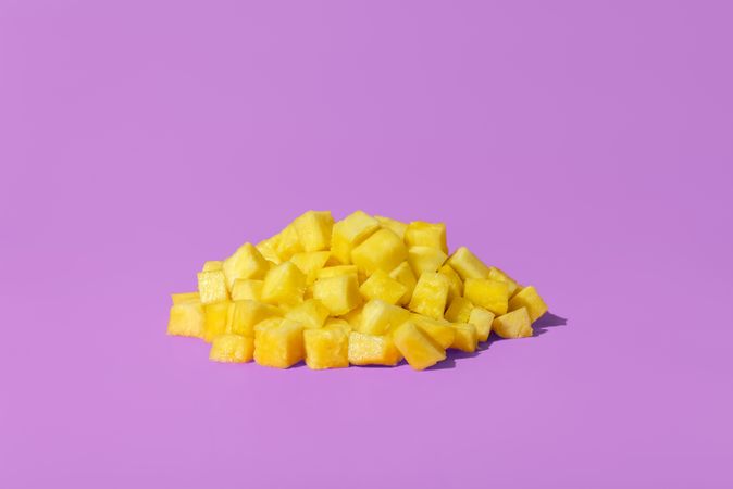 Pineapple pieces on a purple background