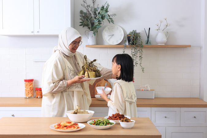 Mom and Kids Preparing ketupat Lebaran for Eid Al Fitr Celebration