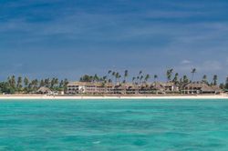 Tropical hotel as seen from clear water