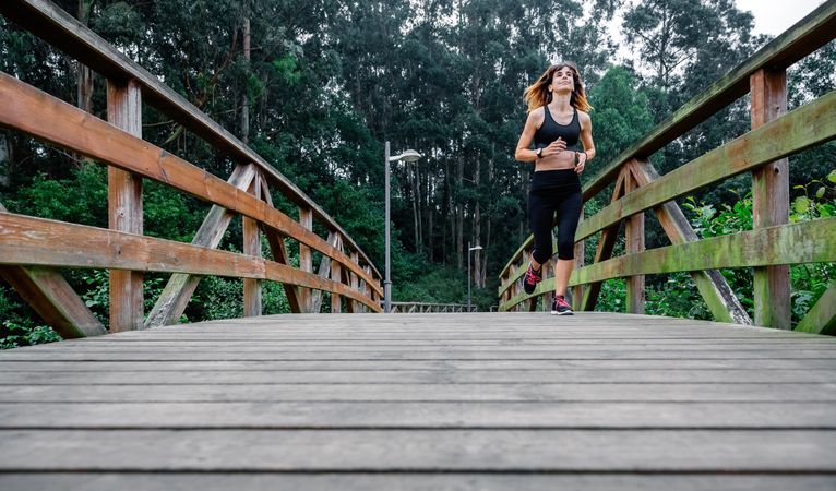 Woman running through an urban park