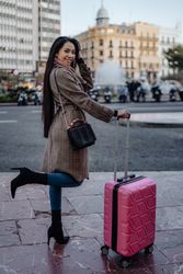Asian tourist on sidewalk in city