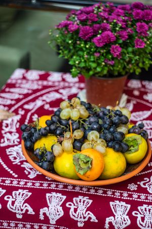 Bowl of persimmon and grapes for Tbilisoba festival in Georgia