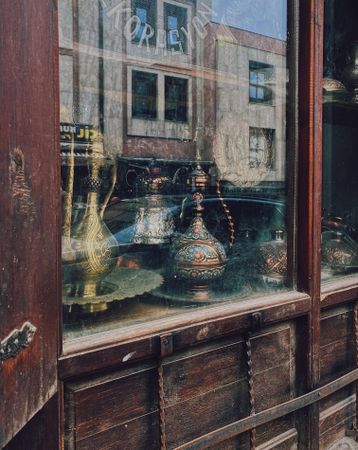 Copper tea pots in shop window