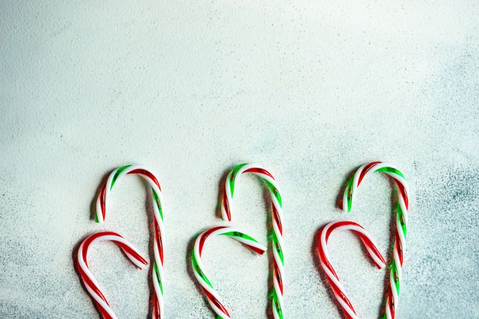 Christmas card concept with candy canes on counter and copy space