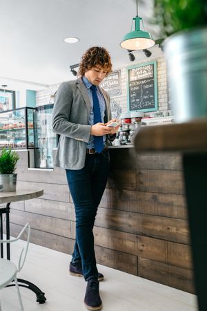 Businessman looking mobile in a cafe