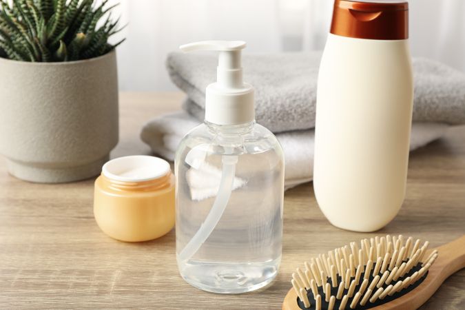 Composition with hair care products on wood table