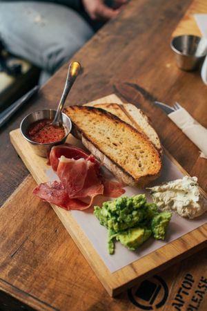 Plate of toast, ham and avocado