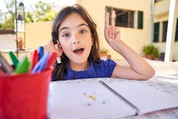 Adorable kid looking at camera with idea in head