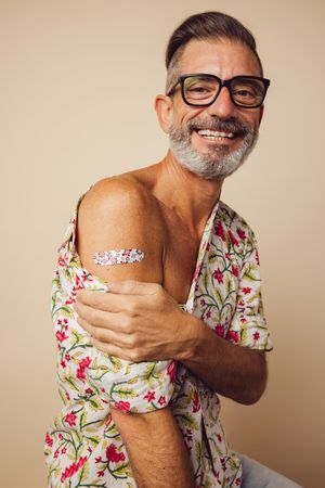 Portrait of man smiling after getting vaccine