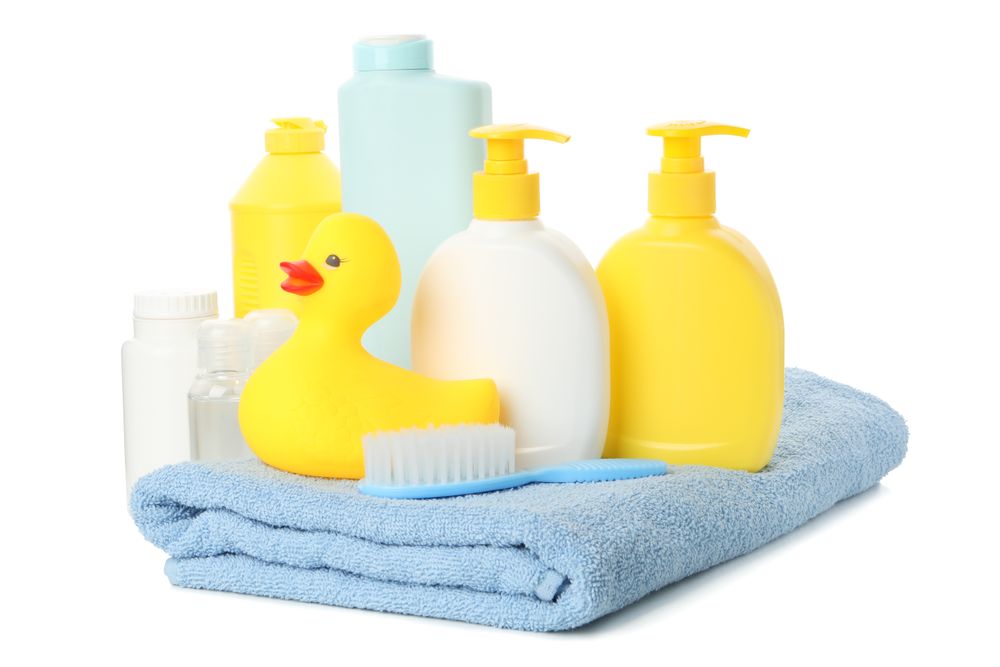 Baby hygiene accessories isolated on light background