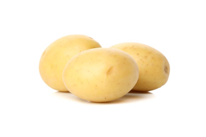 Whole potatoes on blank background