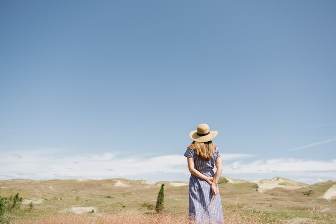 Young woman gathering dried spikes
