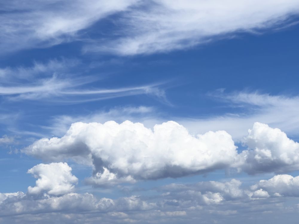 Natural blue sky with thick cumulus mediocris clouds in the afternoon