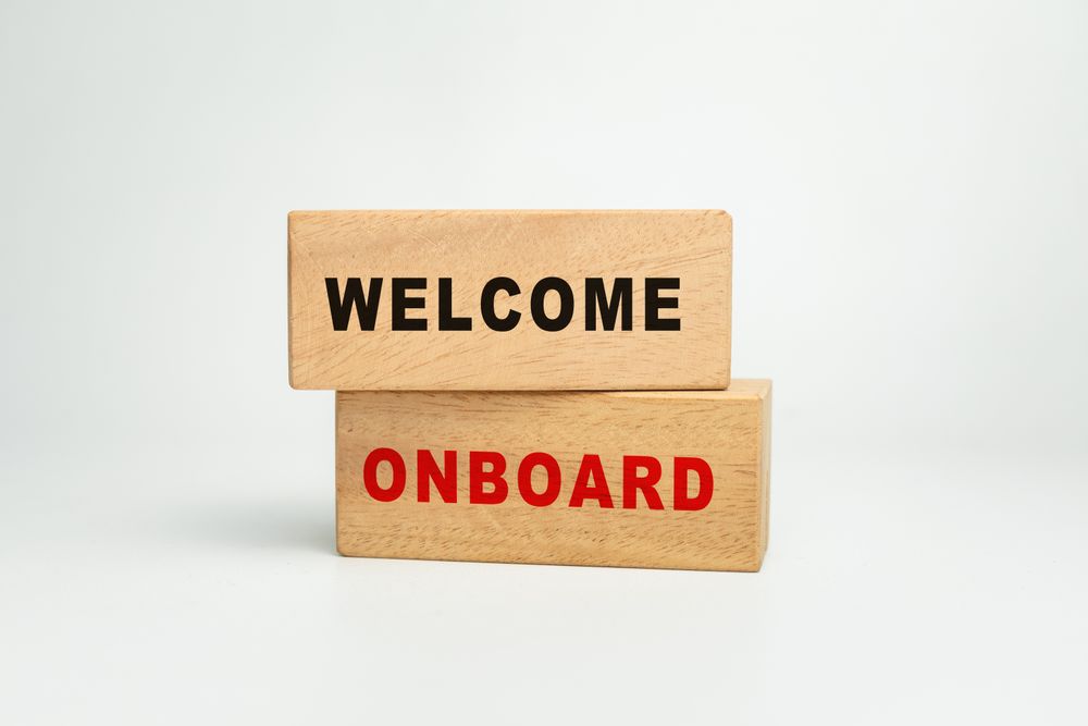 welcome onboard word text on wooden blocks