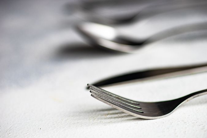 Close up of cutlery set on concrete background