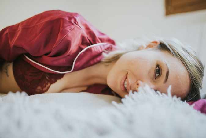 Woman and smiling in bed