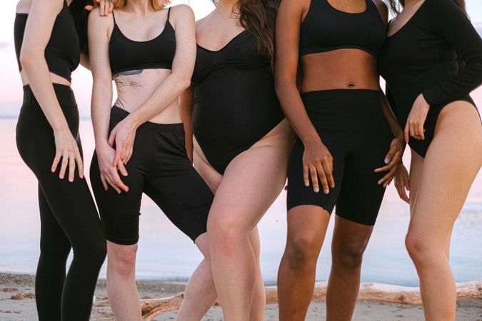 Women of different races and body types standing next to each other