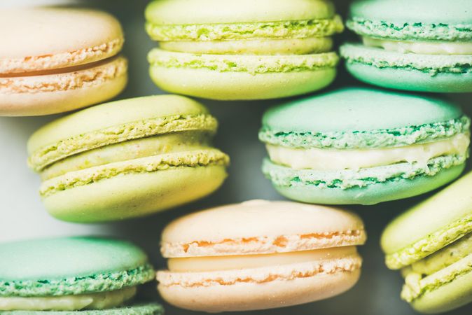 Pastel macaron pastries, stacked, side view, close up