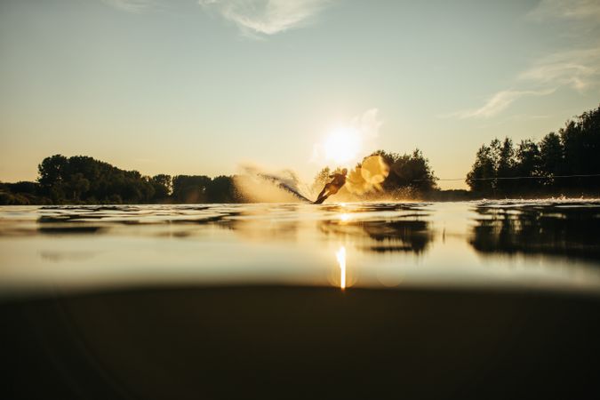 Person wakeboarding on a calm lake