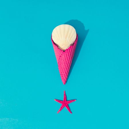 Starfish with pink waffle cone on bright blue background