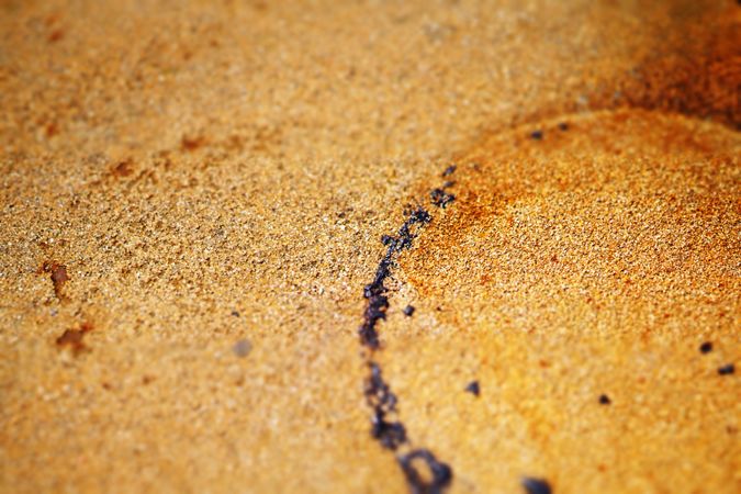 Wet sand texture with circle trace