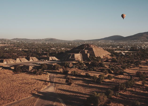 One hot air balloon in flight over pyramids in Teotihuacan Valley