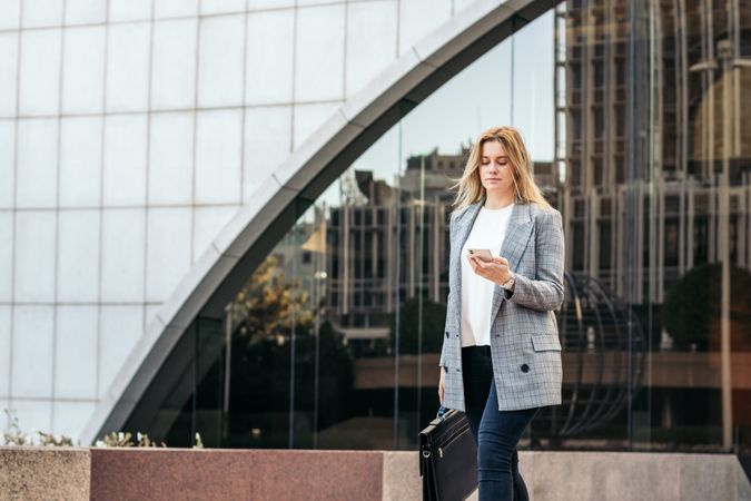 Businesswoman in a suit leaving the office