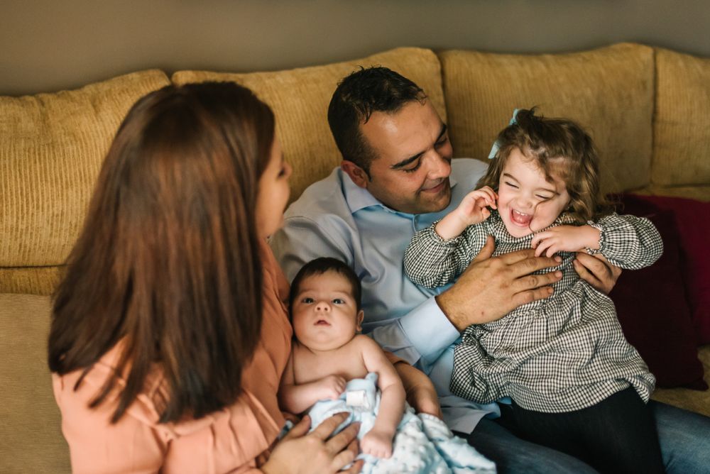 Happy family sitting on couch together